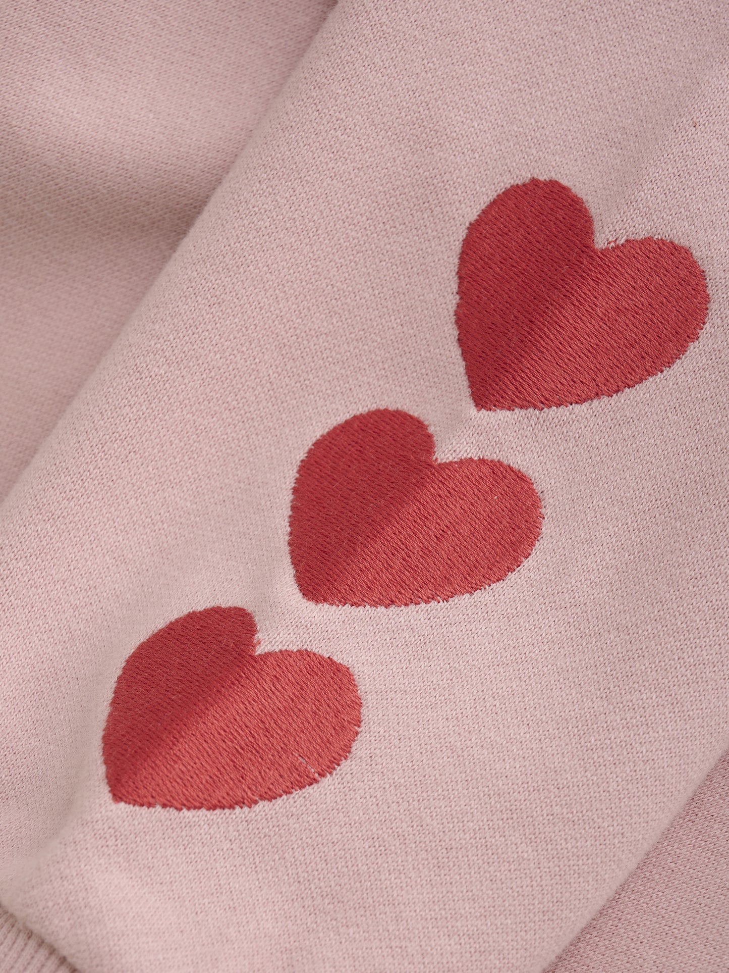 SWEATER WITH HEARTS ON SLEEVE