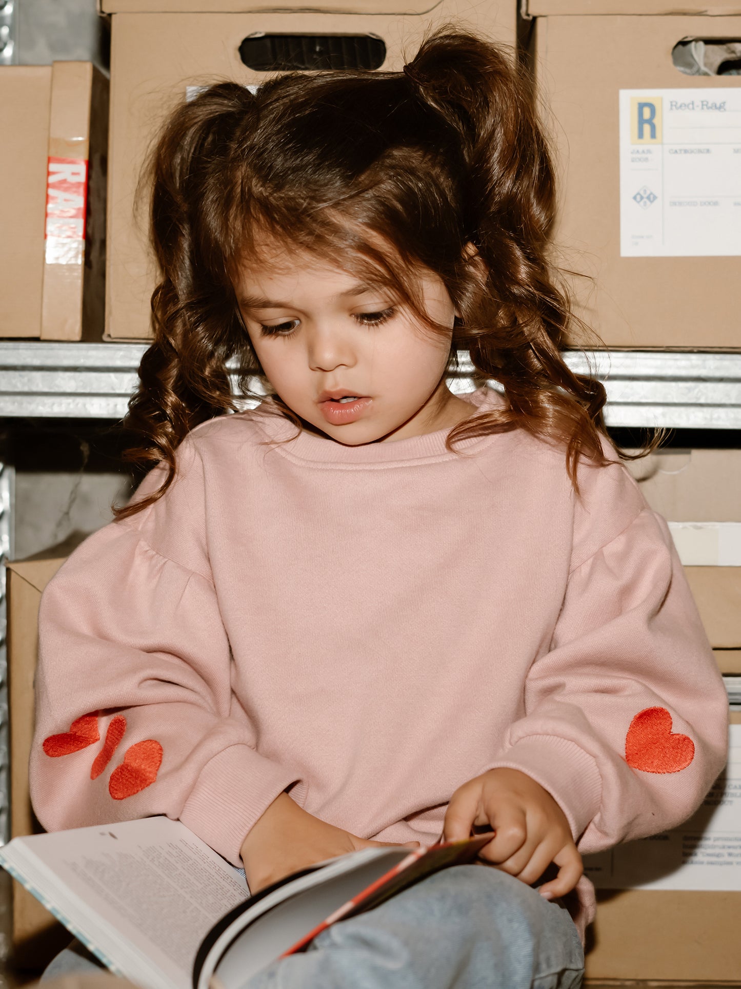 SWEATER WITH HEARTS ON SLEEVE