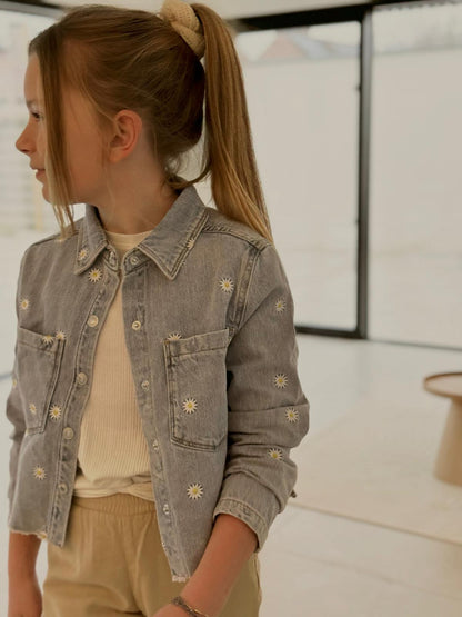 Jeans vest met madeliefjes