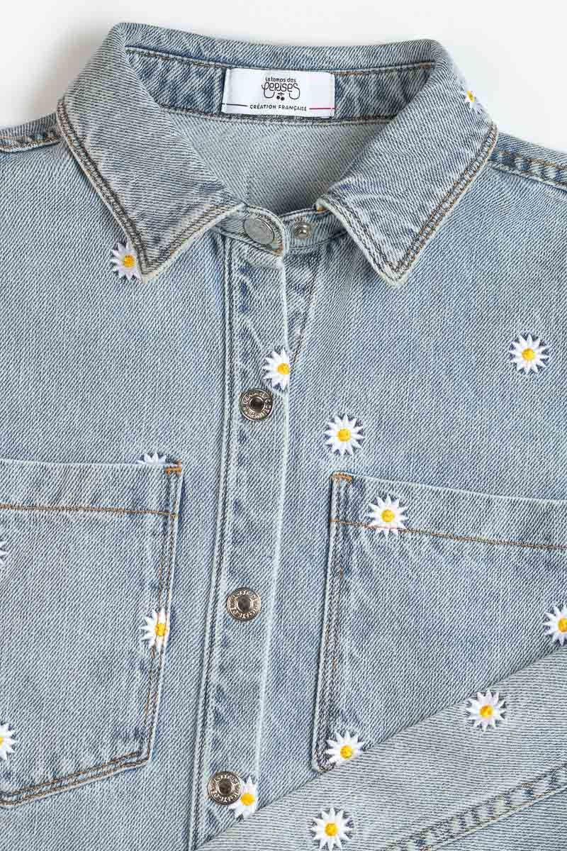 Jeans vest met madeliefjes