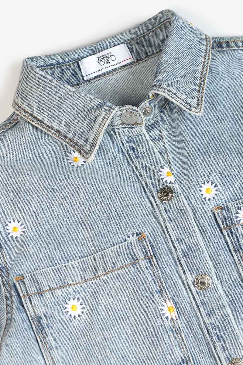 Jeans vest met madeliefjes